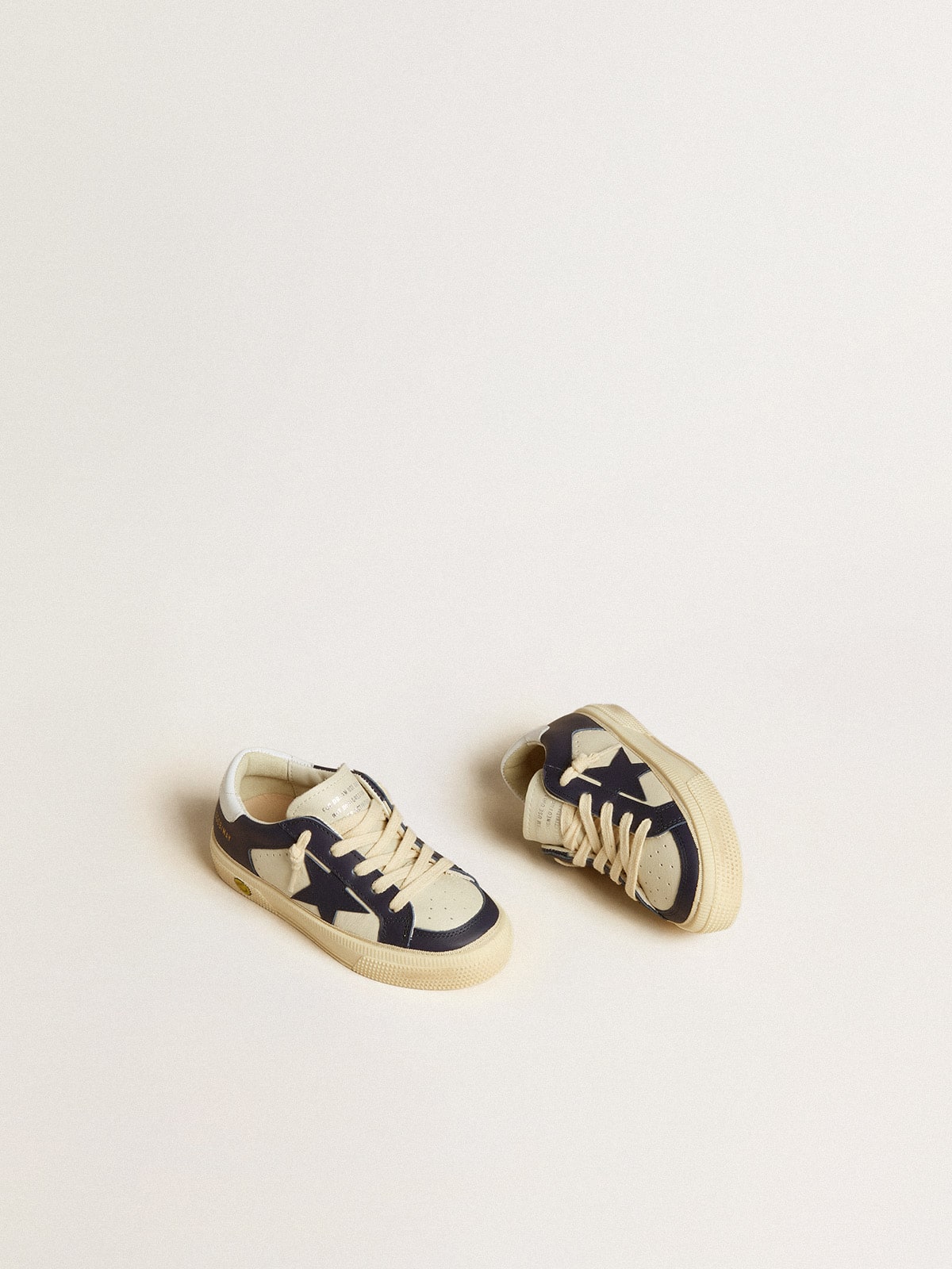 May Young in white and blue leather with leather star and heel tab| Golden Goose