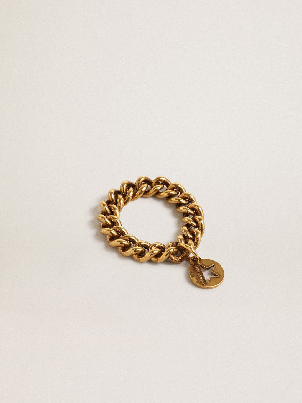 Ring in antique gold color with flexible links| Golden Goose