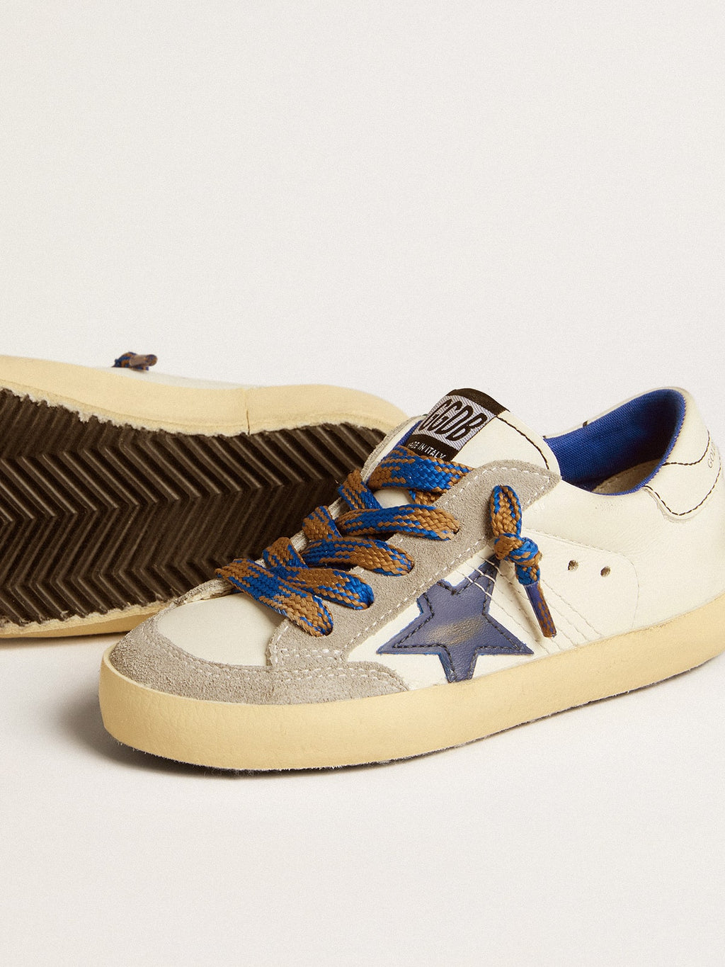 Super-Star Junior with blue leather star and ice-gray suede inserts| Golden Goose