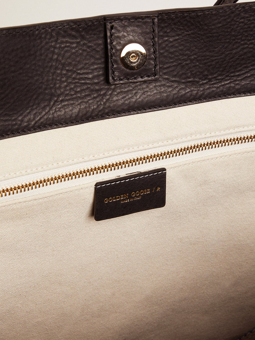 Pasadena Bag in black hammered leather with gold logo on the front| Golden Goose