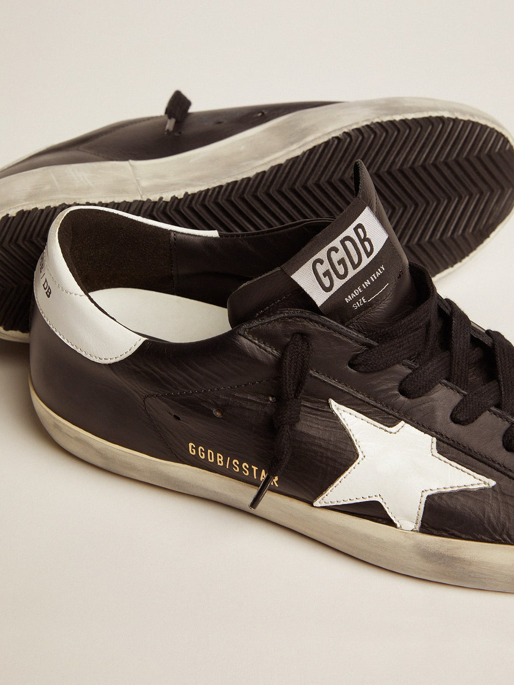 Women's Super-Star in black leather with white leather star and heel tab| Golden Goose