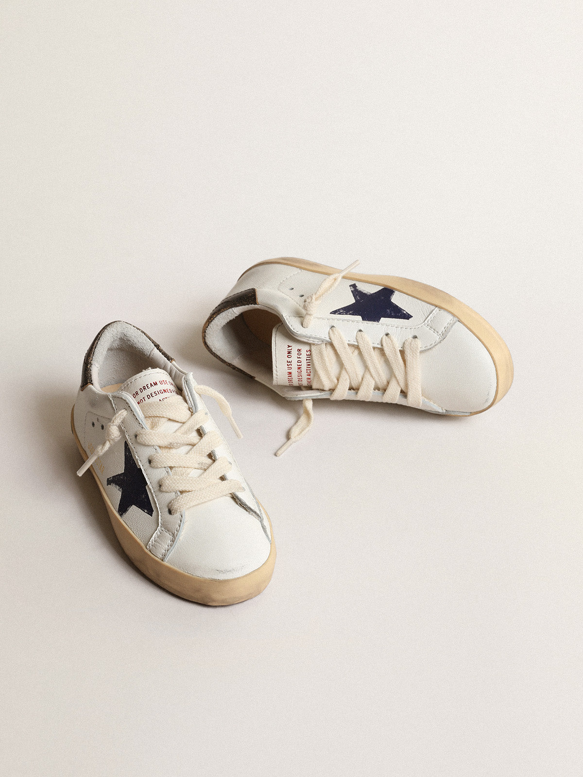 Super-Star Junior in nappa with a printed star and black heel tab| Golden Goose