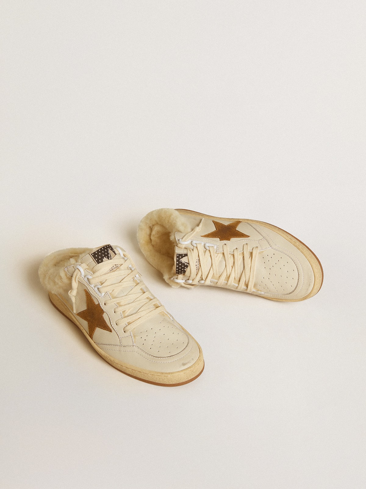 Ball Star Sabots in leather with suede star and beige shearling lining| Golden Goose