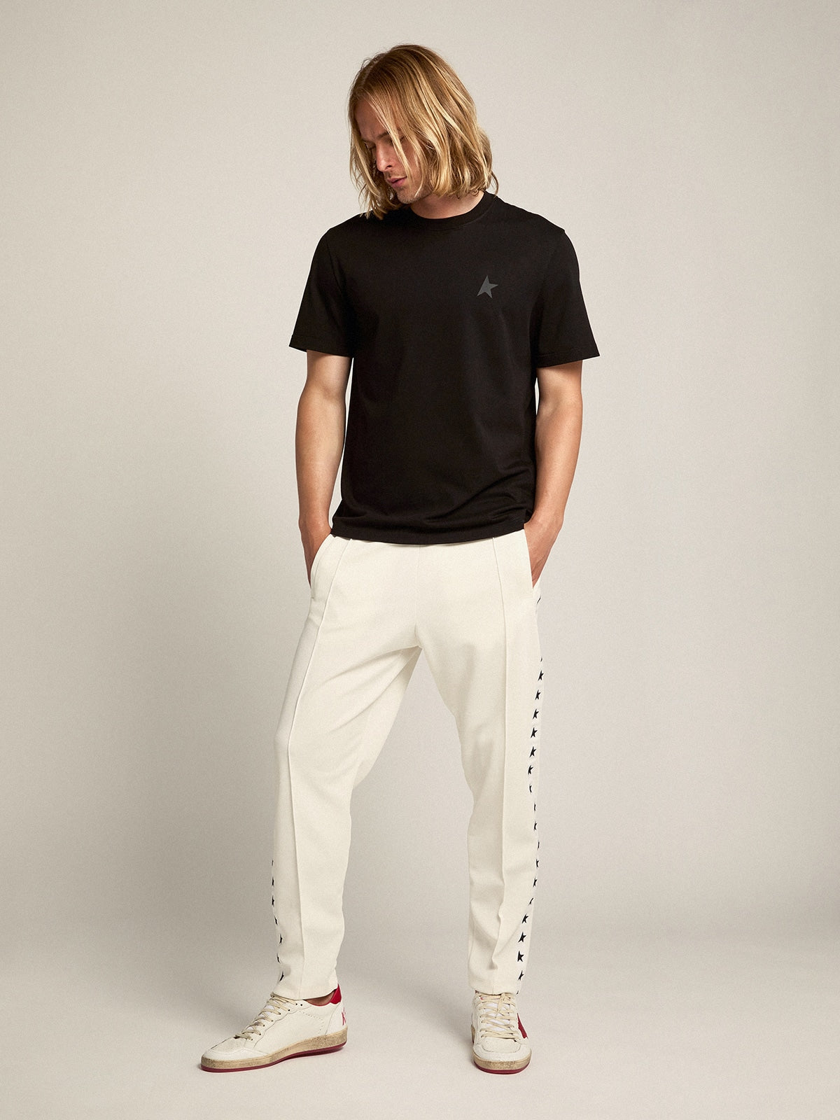 Men's white joggers with black stars on the sides| Golden Goose