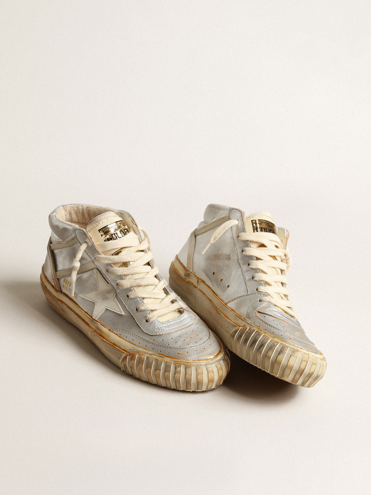 Women's Mid Star in silver metallic leather with ivory star| Golden Goose