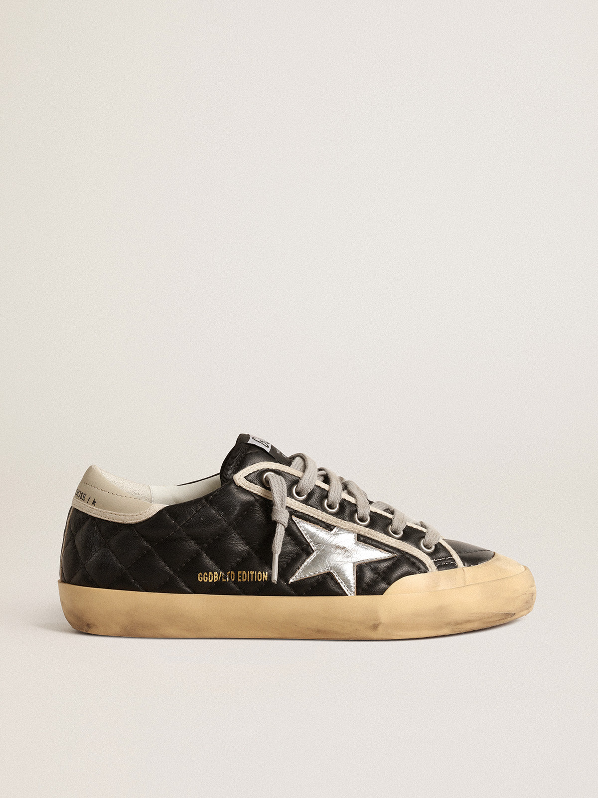 Super-Star Penstar in black matelassé nappa with silver star| Golden Goose