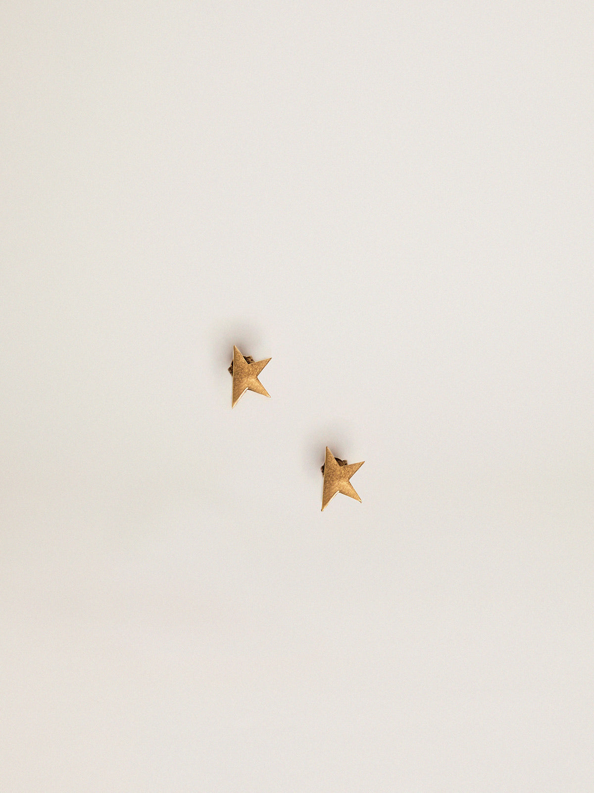 Women's stud earrings in antique gold color| Golden Goose