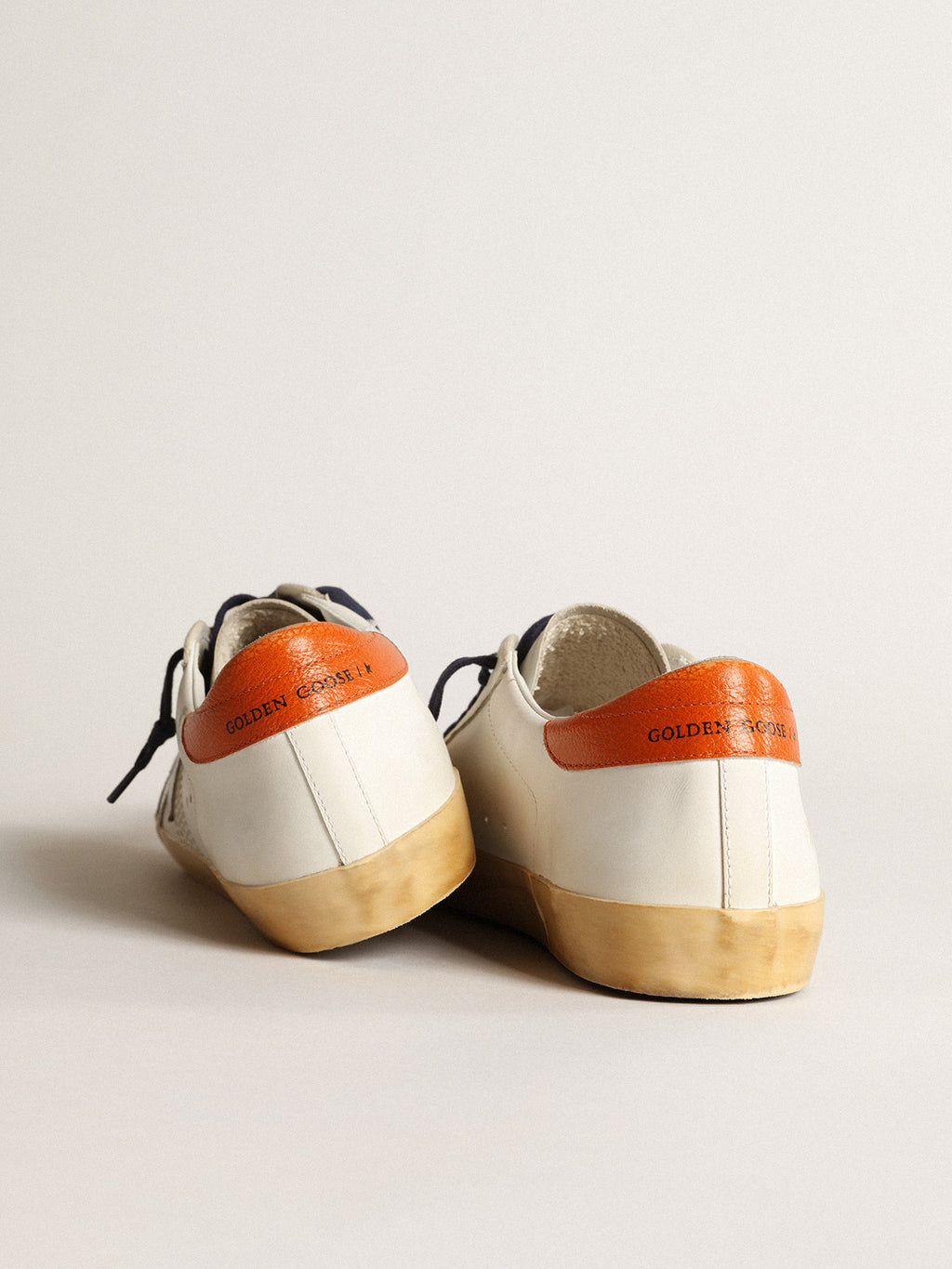 Super-Star Penstar with silver star and orange heel tab| Golden Goose