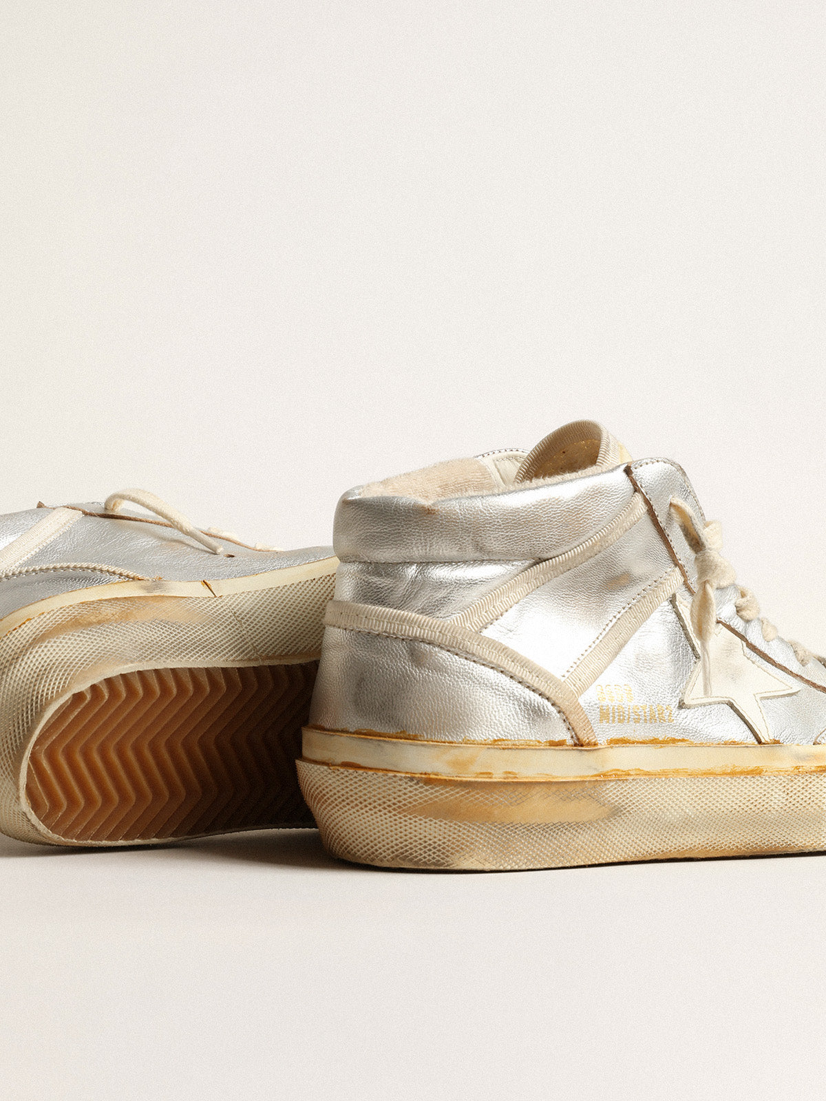 Women's Mid Star in silver metallic leather with ivory star| Golden Goose