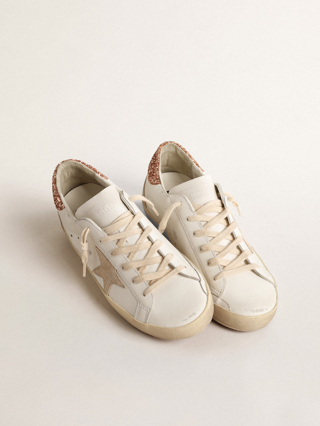Super-Star with a suede star and peach-pink glitter heel tab| Golden Goose