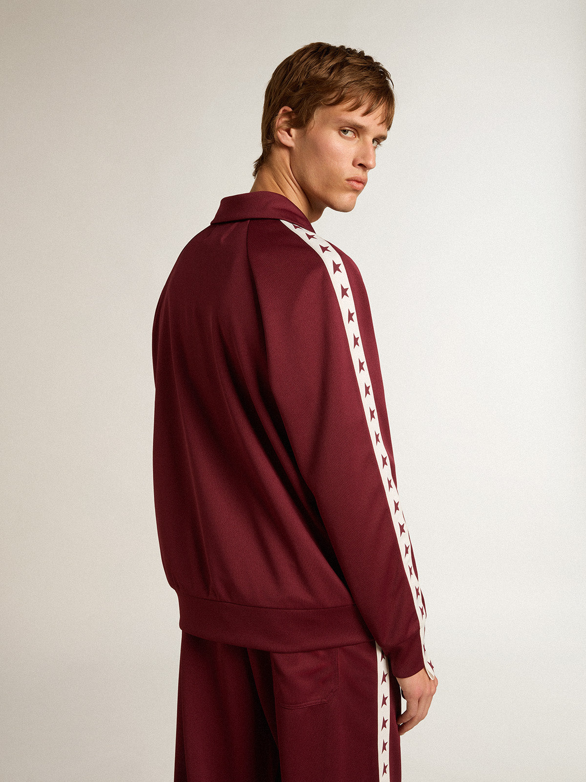 Men's burgundy zipped sweatshirt with white strip and contrasting stars| Golden Goose