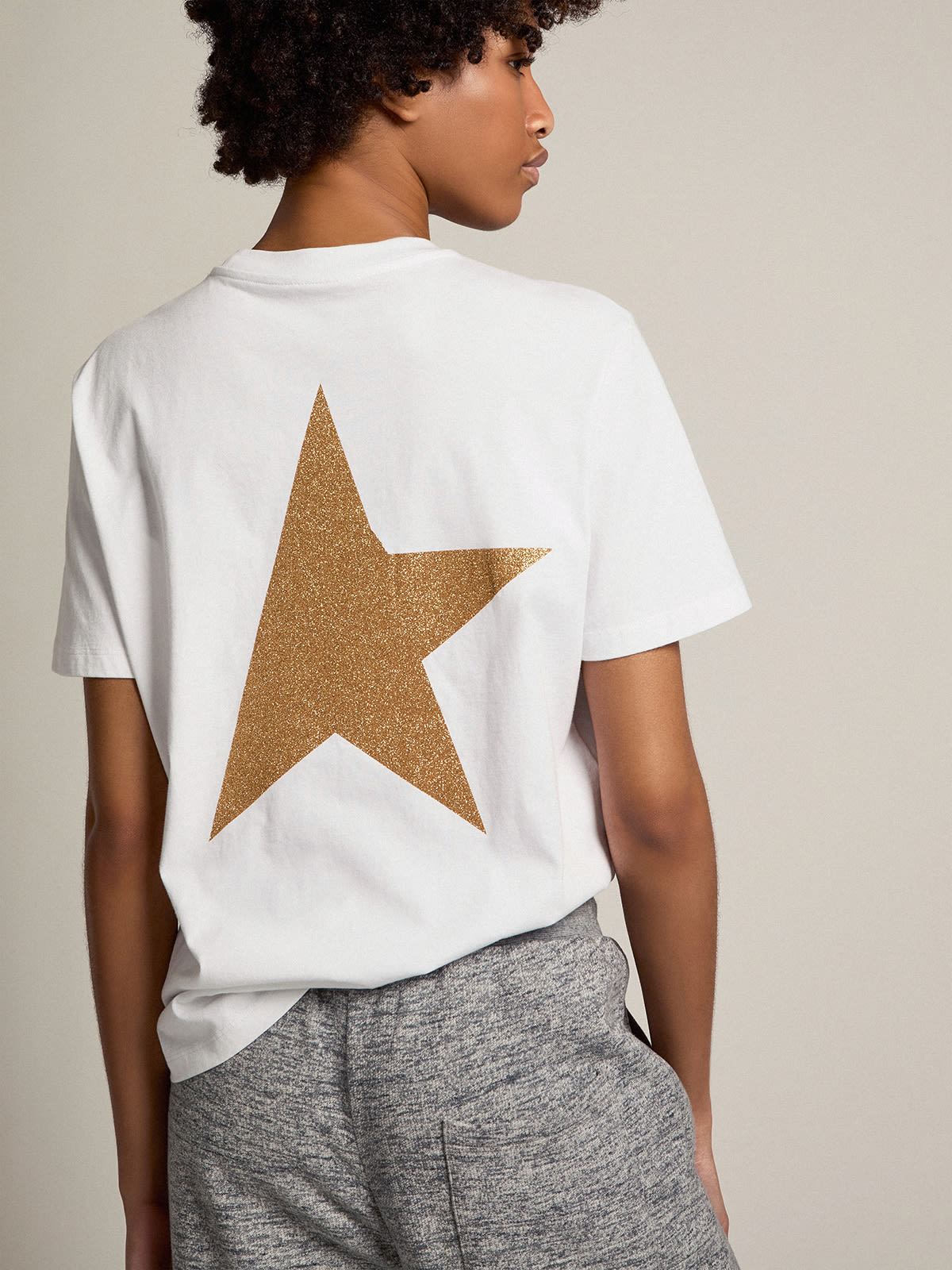 Women's white T-shirt with gold glitter logo and star| Golden Goose