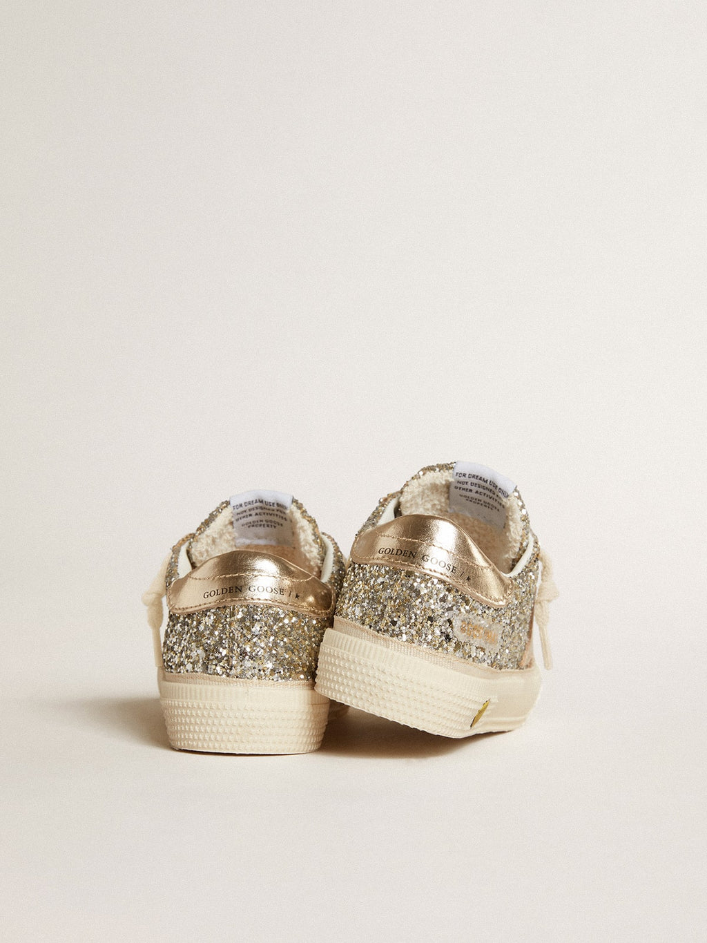 May Young in platinum glitter with metallic leather star and heel tab| Golden Goose
