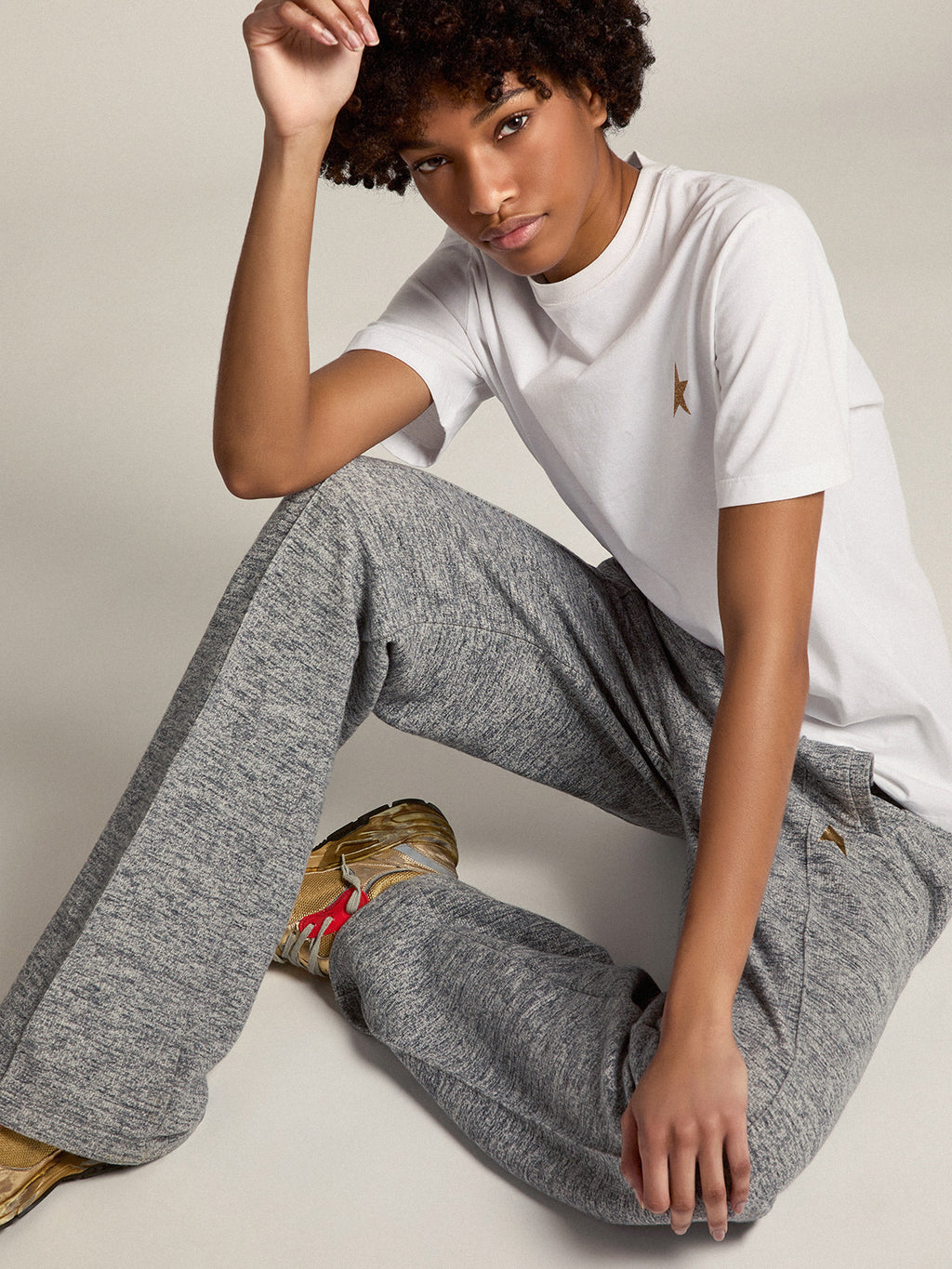 Women's gray joggers with gold star on the front| Golden Goose